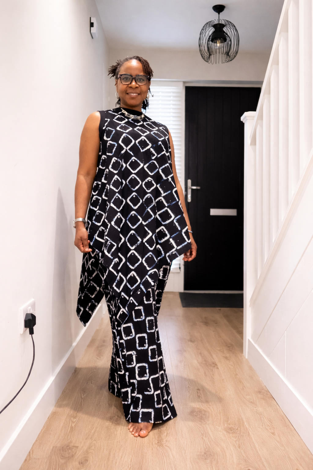 Full length elastic waist trousers with sleeveless free top 